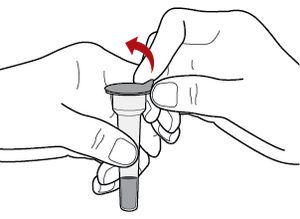 Fingers pinch the small tab of the seal and peel it off the top of the tube